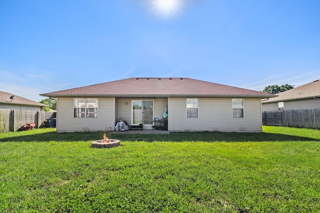 208 Dixie Ave, Clever, MO 65631 - rear view of house featuring an outdoor fire pit, a fenced backyard, and a patio area