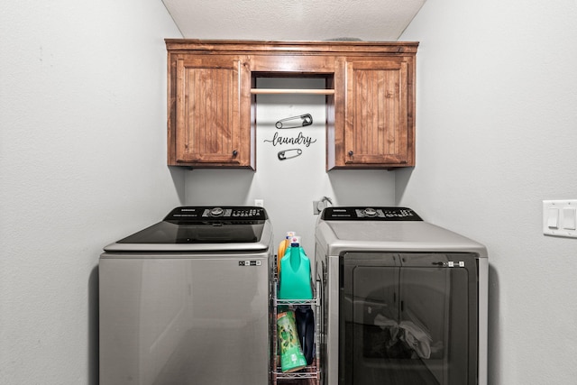 208 Dixie Ave, Clever, MO 65631 - laundry area featuring cabinet space, washing machine and clothes dryer, and a textured ceiling