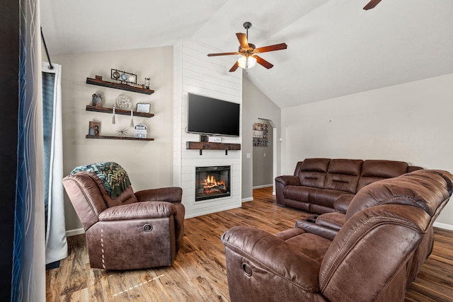 208 Dixie Ave, Clever, MO 65631 - living room with ceiling fan, lofted ceiling, a fireplace, and wood finished floors