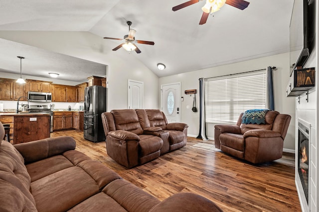 208 Dixie Ave, Clever, MO 65631 - living area with a ceiling fan, lofted ceiling, and wood finished floors