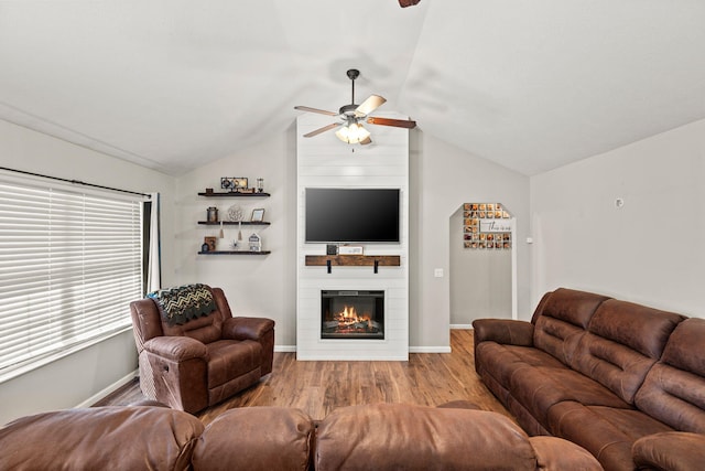 208 Dixie Ave, Clever, MO 65631 - living room featuring a ceiling fan, wood finished floors, a large fireplace, and lofted ceiling