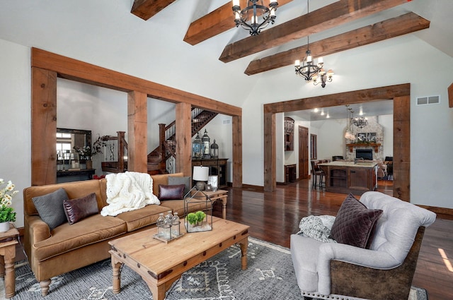 7607 N Angler Ln, Strafford, MO 65757 - living area with a chandelier, dark wood finished floors, beam ceiling, a fireplace, and high vaulted ceiling