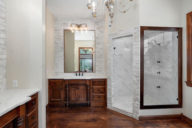 7607 N Angler Ln, Strafford, MO 65757 - bathroom with a chandelier, vanity, a marble finish shower, and wood finished floors