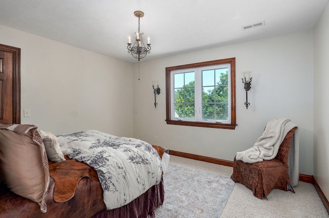 7607 N Angler Ln, Strafford, MO 65757 - bedroom with light colored carpet and a chandelier