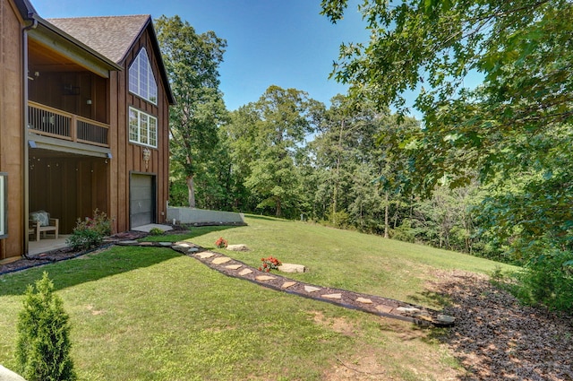 7607 N Angler Ln, Strafford, MO 65757 - view of grassy yard featuring an attached garage