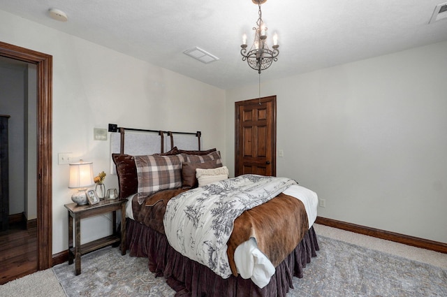 7607 N Angler Ln, Strafford, MO 65757 - carpeted bedroom with baseboards and a chandelier