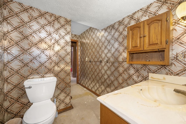 26307 Twin Rivers Dr, Shell Knob, MO 65747 - bathroom featuring vanity, a textured ceiling, and wallpapered walls