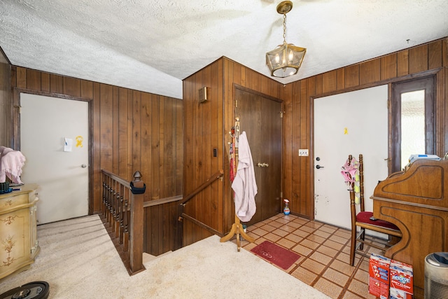 26307 Twin Rivers Dr, Shell Knob, MO 65747 - foyer entrance featuring wood walls and a textured ceiling