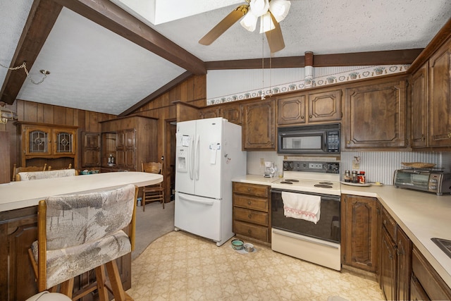 26307 Twin Rivers Dr, Shell Knob, MO 65747 - kitchen with white appliances, light countertops, wood walls, light floors, and a ceiling fan