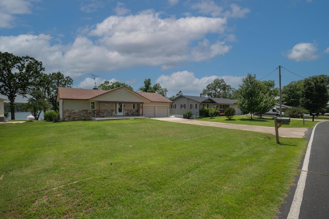 26307 Twin Rivers Dr, Shell Knob, MO 65747 - single story home with a garage, driveway, a front yard, and stone siding