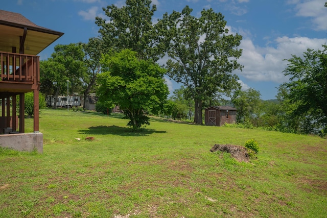 26307 Twin Rivers Dr, Shell Knob, MO 65747 - view of grassy yard featuring a storage shed and a deck