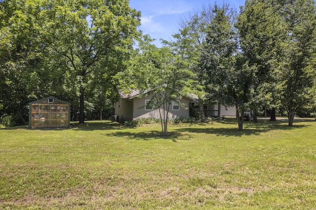 29474 Farm Rd Unit 1260, Golden, MO 65658 - view of green lawn with an exterior structure and an outbuilding