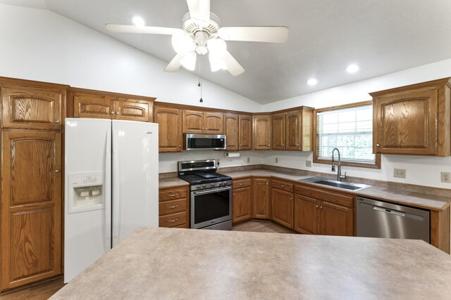 29474 Farm Rd Unit 1260, Golden, MO 65658 - kitchen with appliances with stainless steel finishes, lofted ceiling, recessed lighting, ceiling fan, and brown cabinetry