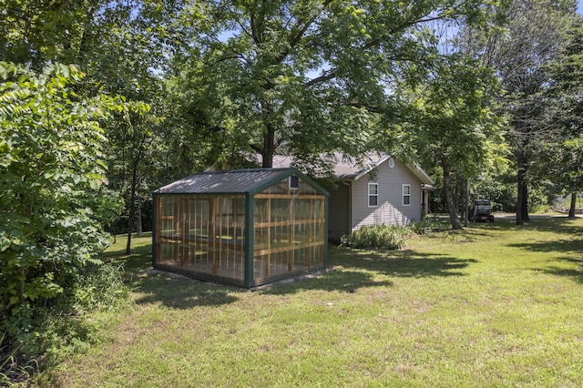 29474 Farm Rd Unit 1260, Golden, MO 65658 - view of green lawn with a greenhouse and an outbuilding
