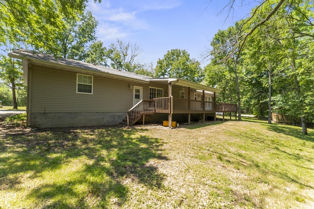29474 Farm Rd Unit 1260, Golden, MO 65658 - back of house featuring a deck and a yard