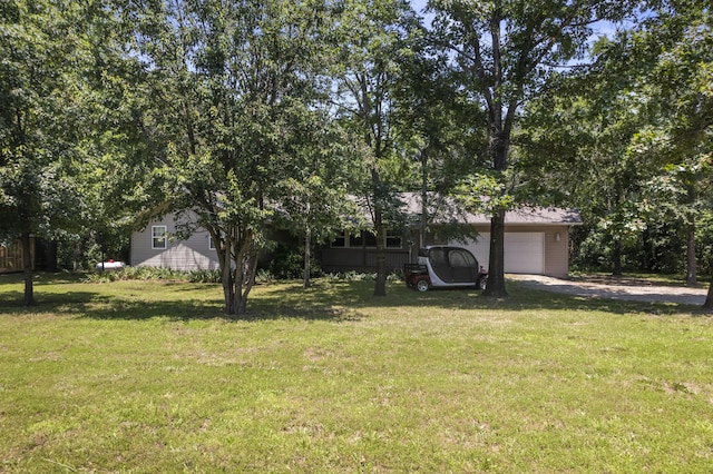 29474 Farm Rd Unit 1260, Golden, MO 65658 - view of green lawn featuring a garage