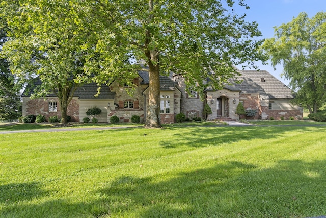 4156 E Division St, Springfield, MO 65802 - view of front of property featuring a front lawn, brick siding, and stone siding