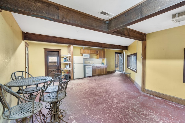 4156 E Division St, Springfield, MO 65802 - dining room featuring beam ceiling and baseboards