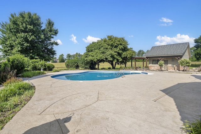4156 E Division St, Springfield, MO 65802 - view of pool featuring a patio, an outbuilding, a pergola, and a storage structure