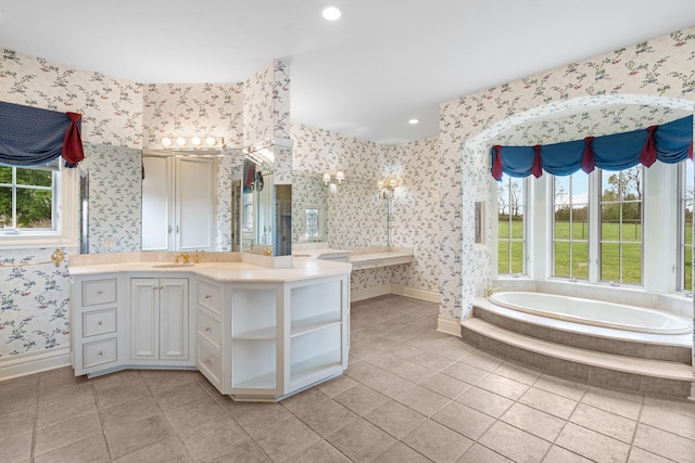 4156 E Division St, Springfield, MO 65802 - bathroom featuring wallpapered walls, a garden tub, vanity, tile patterned floors, and recessed lighting