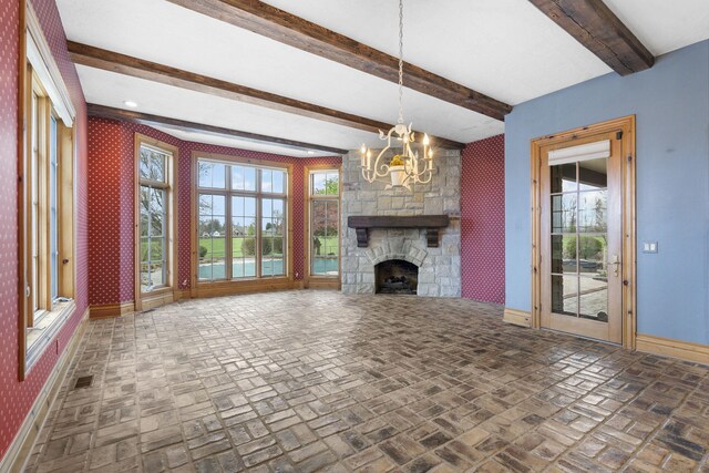 4156 E Division St, Springfield, MO 65802 - unfurnished living room with brick floors, a chandelier, wallpapered walls, beamed ceiling, and a fireplace