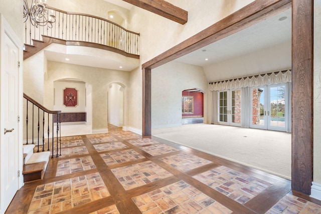 4156 E Division St, Springfield, MO 65802 - entrance foyer featuring arched walkways, a high ceiling, stairway, and recessed lighting