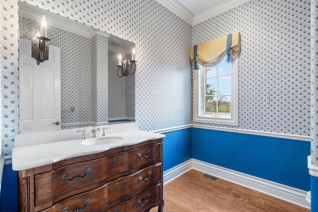4156 E Division St, Springfield, MO 65802 - bathroom featuring ornamental molding, wallpapered walls, wood finished floors, and vanity