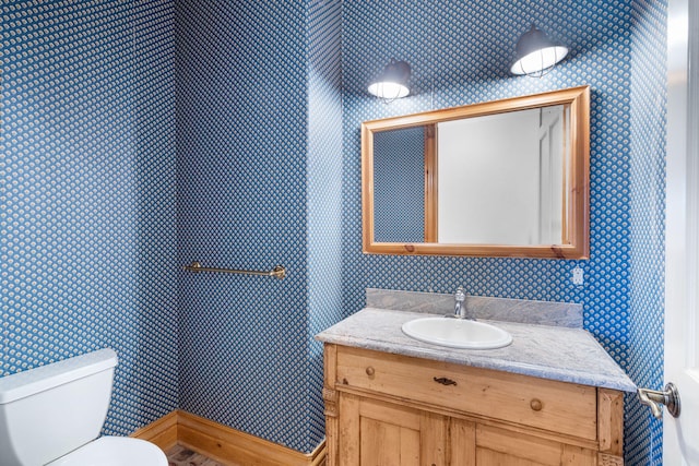 4156 E Division St, Springfield, MO 65802 - bathroom with wallpapered walls and vanity