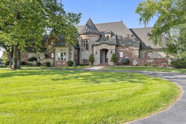 4156 E Division St, Springfield, MO 65802 - french country style house with stone siding, a front lawn, and brick siding