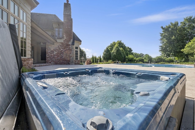 4156 E Division St, Springfield, MO 65802 - view of swimming pool with a hot tub