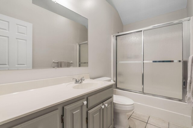 2504 W Fox Fire Ct, Nixa, MO 65714 - full bathroom featuring vanity, tile patterned floors, and shower / bath combination with glass door