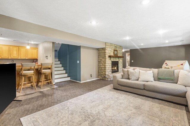 2504 W Fox Fire Ct, Nixa, MO 65714 - carpeted living area with wet bar, recessed lighting, a fireplace, and stairs