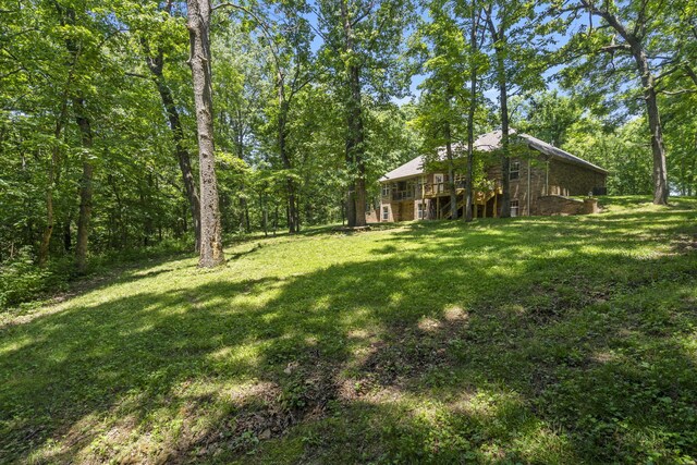 2504 W Fox Fire Ct, Nixa, MO 65714 - view of green lawn with a wooden deck