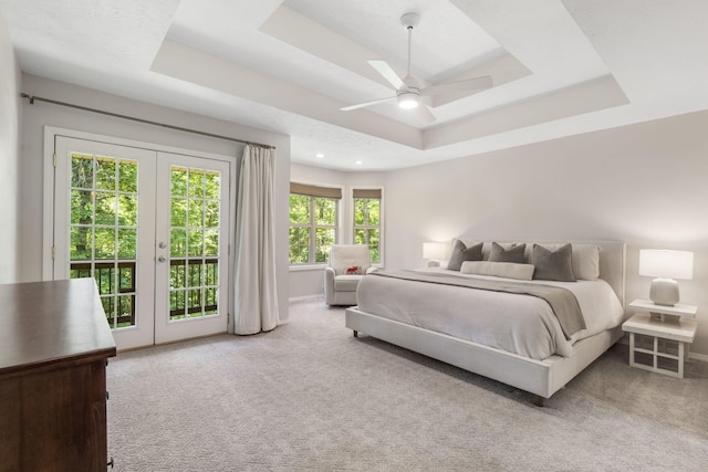 2504 W Fox Fire Ct, Nixa, MO 65714 - carpeted bedroom with a tray ceiling, access to outside, french doors, a ceiling fan, and recessed lighting