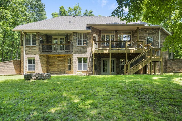 2504 W Fox Fire Ct, Nixa, MO 65714 - back of property featuring a lawn, a deck, brick siding, and stairway