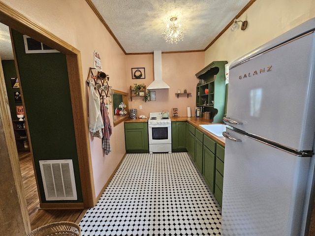 312 W Locust St, Aurora, MO 65605 - kitchen featuring green cabinetry, white appliances, wall chimney exhaust hood, crown molding, and a textured ceiling