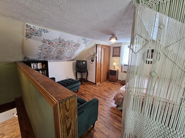 312 W Locust St, Aurora, MO 65605 - living area featuring wood finished floors and a textured ceiling