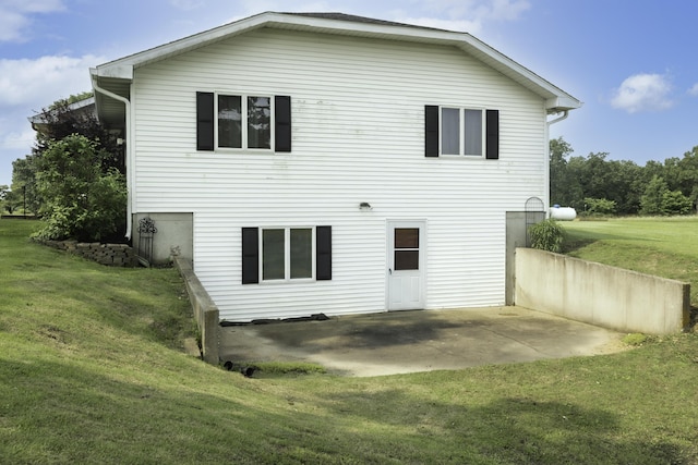 249 State Highway 73, Macks Creek, MO 65786 - rear view of house with a lawn and a patio area