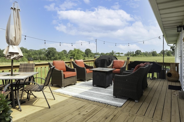 249 State Highway 73, Macks Creek, MO 65786 - wooden terrace with a grill, an outdoor living space with a fire pit, and outdoor dining area