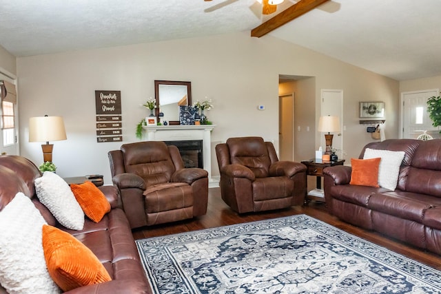 249 State Highway 73, Macks Creek, MO 65786 - living area with wood finished floors, ceiling fan, and a fireplace
