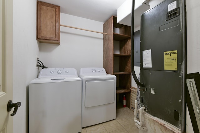 18054 State Highway 39, Aurora, MO 65605 - laundry room with cabinet space, heating unit, washer and clothes dryer, and light tile patterned flooring