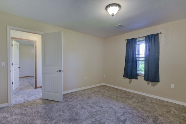 18054 State Highway 39, Aurora, MO 65605 - carpeted empty room with baseboards