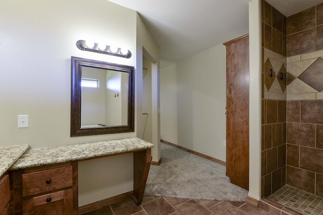 18054 State Highway 39, Aurora, MO 65605 - bathroom featuring tiled shower, vanity, and tile patterned flooring