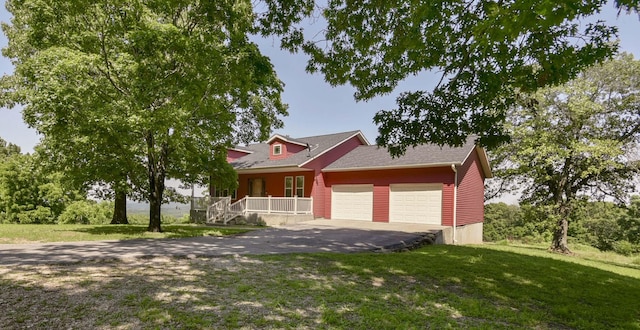18054 State Highway 39, Aurora, MO 65605 - view of front of home with covered porch, an attached garage, driveway, and a front lawn