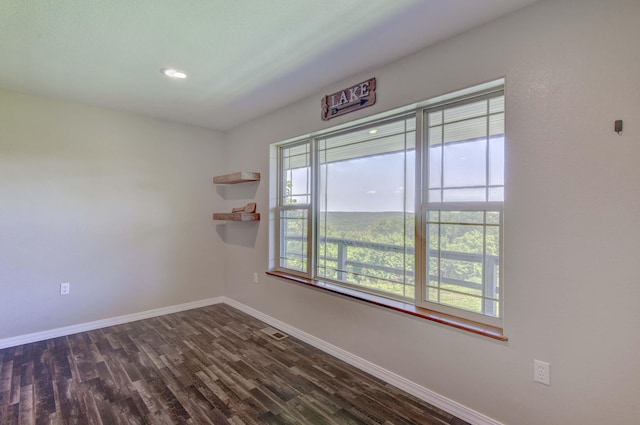 18054 State Highway 39, Aurora, MO 65605 - empty room with dark wood-type flooring and recessed lighting