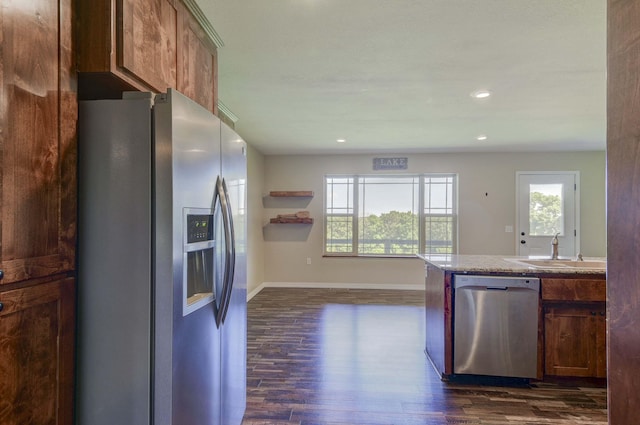 18054 State Highway 39, Aurora, MO 65605 - kitchen with stainless steel appliances, dark wood finished floors, recessed lighting, and brown cabinetry