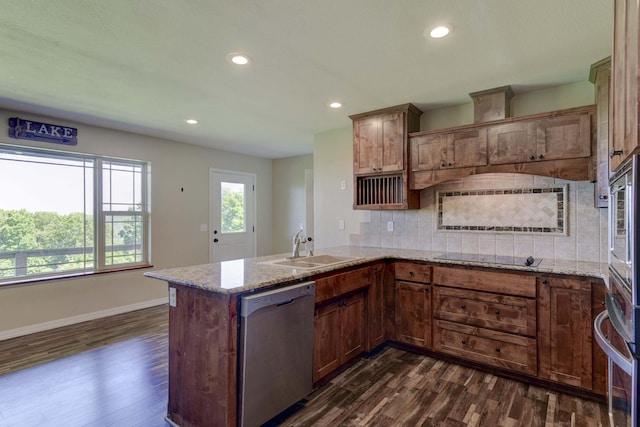 18054 State Highway 39, Aurora, MO 65605 - kitchen with appliances with stainless steel finishes, dark wood-style flooring, a peninsula, tasteful backsplash, and recessed lighting