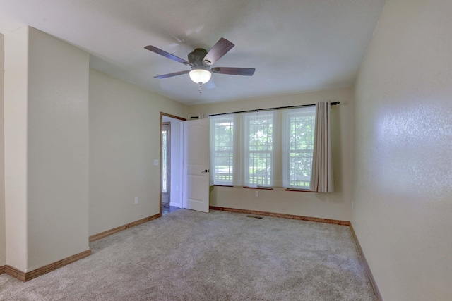 18054 State Highway 39, Aurora, MO 65605 - carpeted empty room with baseboards and a ceiling fan