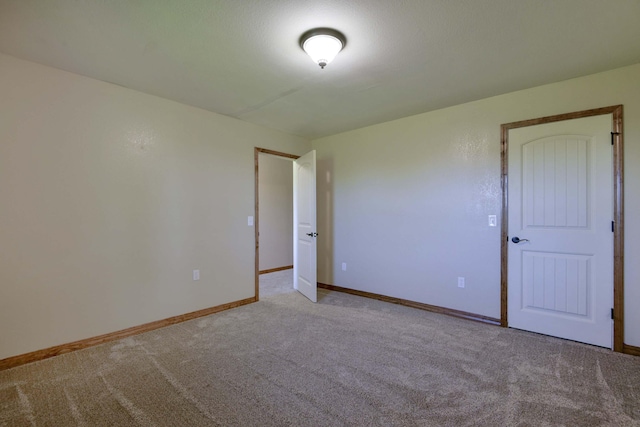 18054 State Highway 39, Aurora, MO 65605 - carpeted spare room featuring baseboards