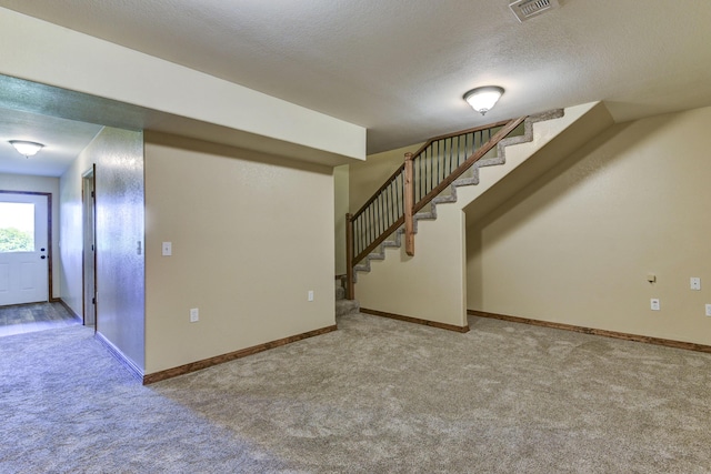 18054 State Highway 39, Aurora, MO 65605 - below grade area with carpet flooring, stairs, and a textured ceiling